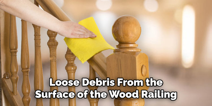 Loose Debris From the Surface of the Wood Railing