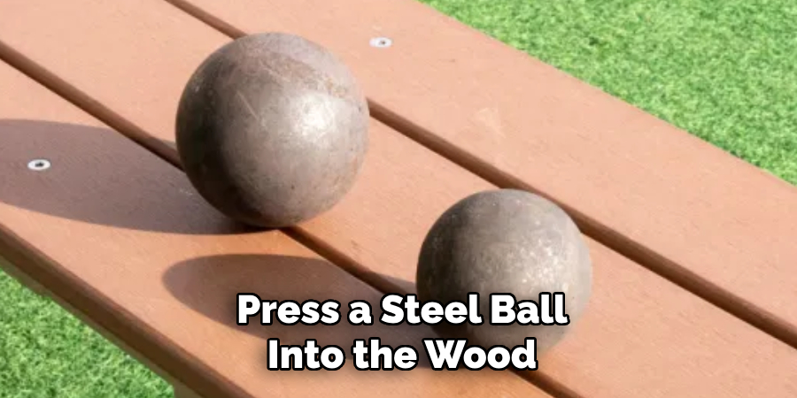 Press a Steel Ball Into the Wood