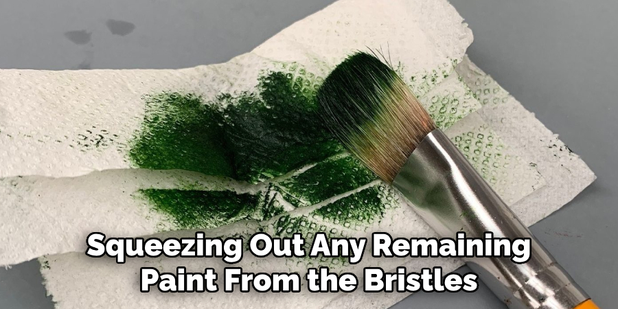 Squeezing Out Any Remaining Paint From the Bristles