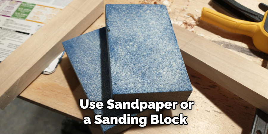 Use Sandpaper or a Sanding Block