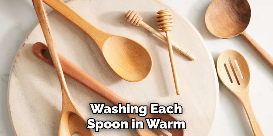 Washing Each
Spoon in Warm 